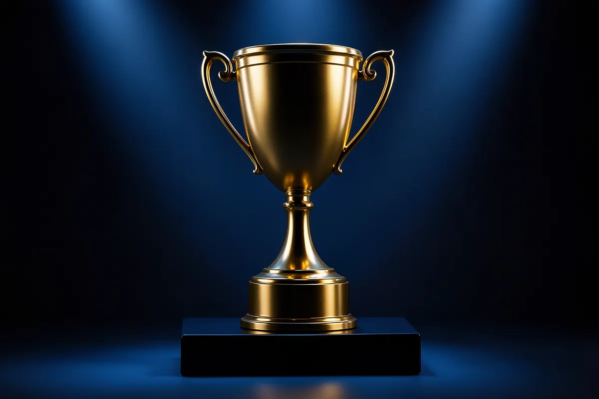 Um troféu dourado em um pódio com luzes brilhantes